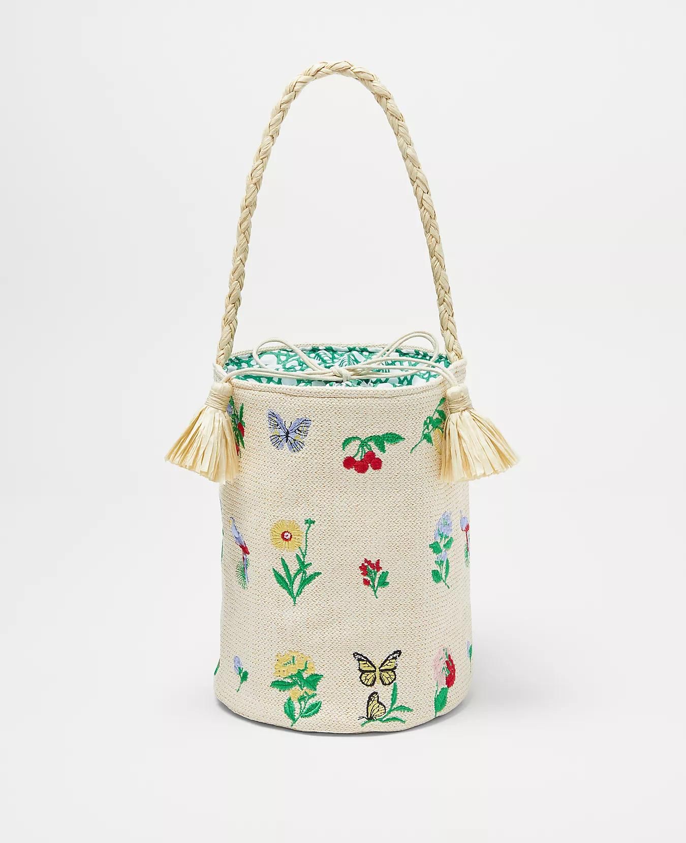 With a braided rope handle and fringed tassels, this Ann Taylor bucket bag is a great addition to any look for the summer.